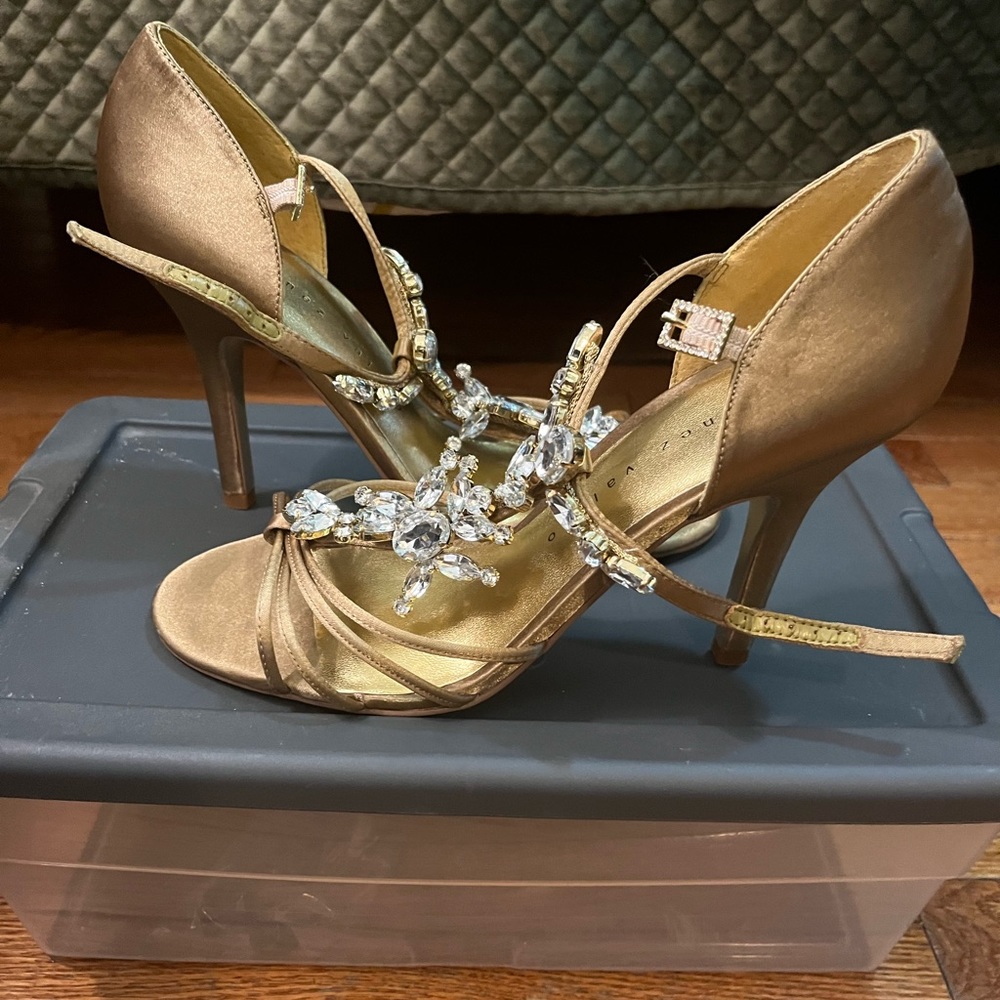 Gold satin, crystal details on strap. Brand new, size 7